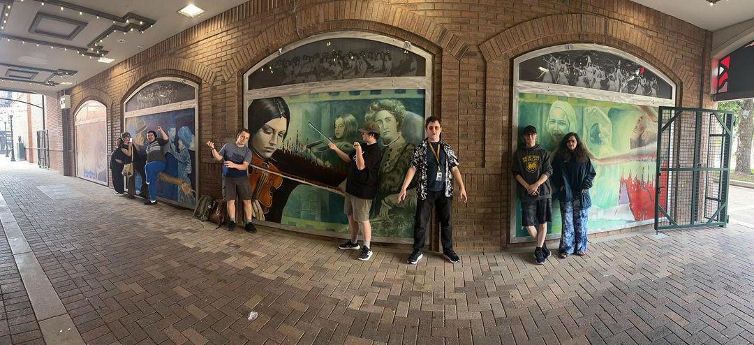 Group of honors students in front of Greeley tunnel mural